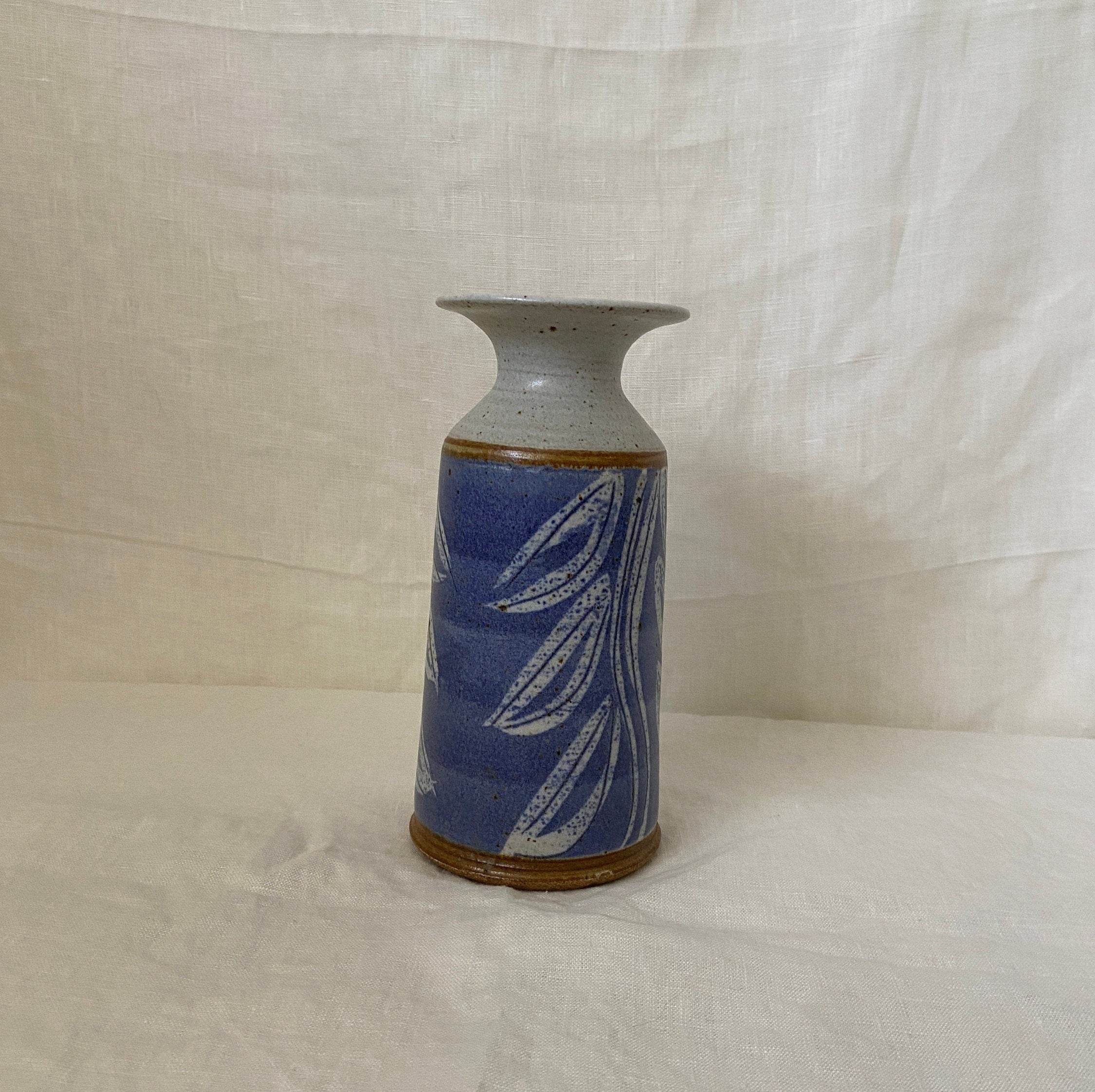 Purple ceramic vase with leaf design