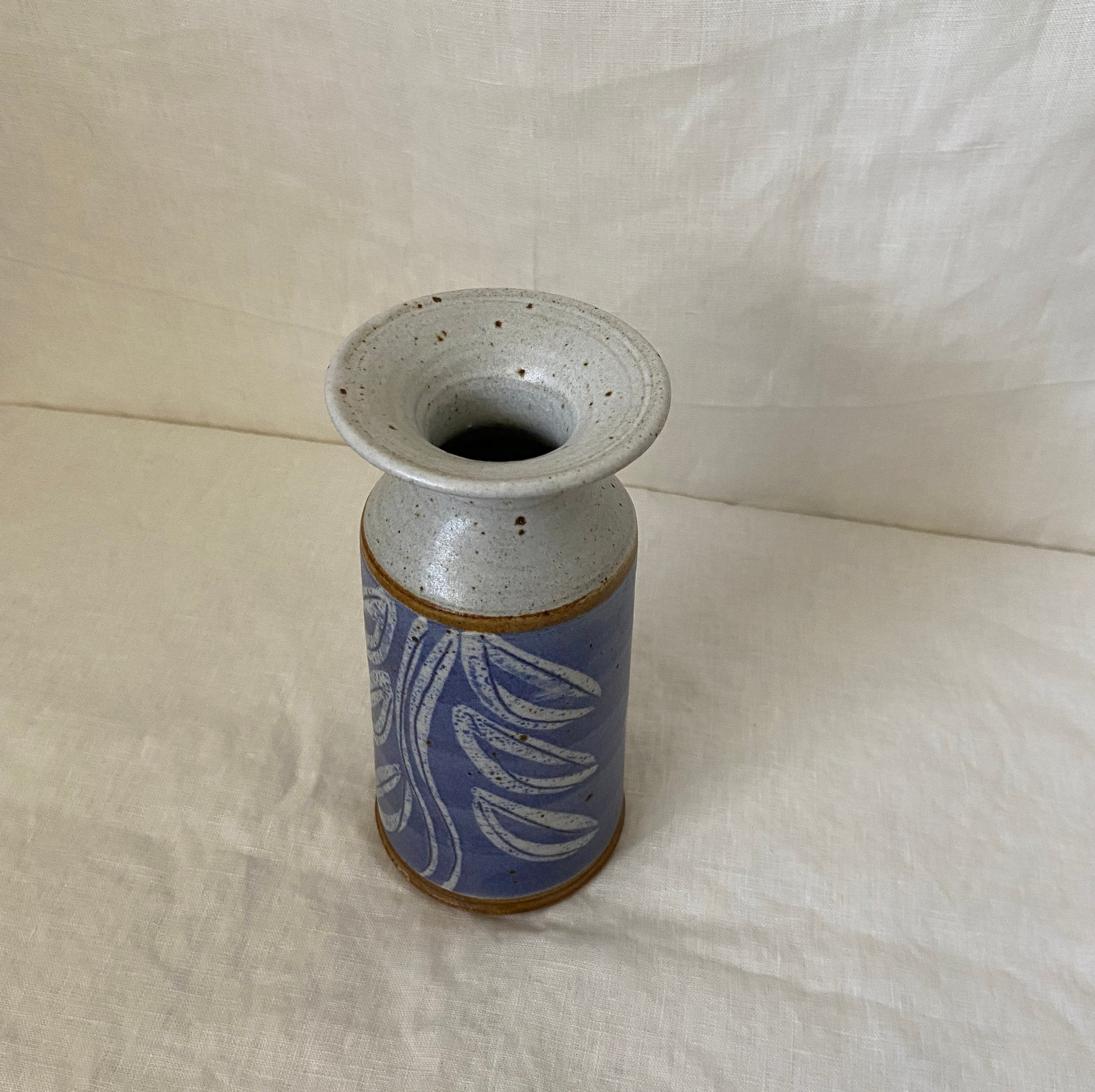 Purple ceramic vase with leaf design